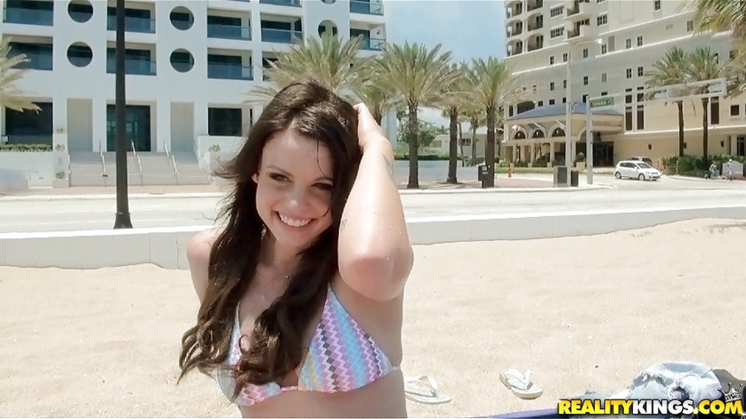 Gentle brunette is sunbathing on the beach and fucking in bed
