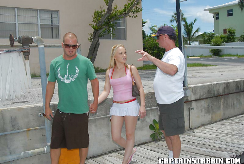 Blonde girl Judy oiled and drilled outdoors by a sexy captain