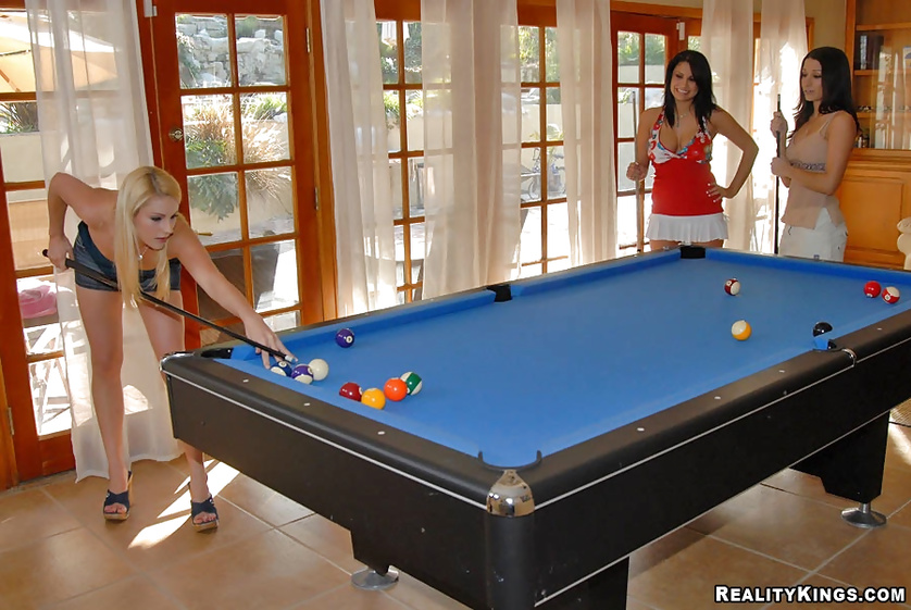Three ladies are playing billiards and having unforgettable threesome